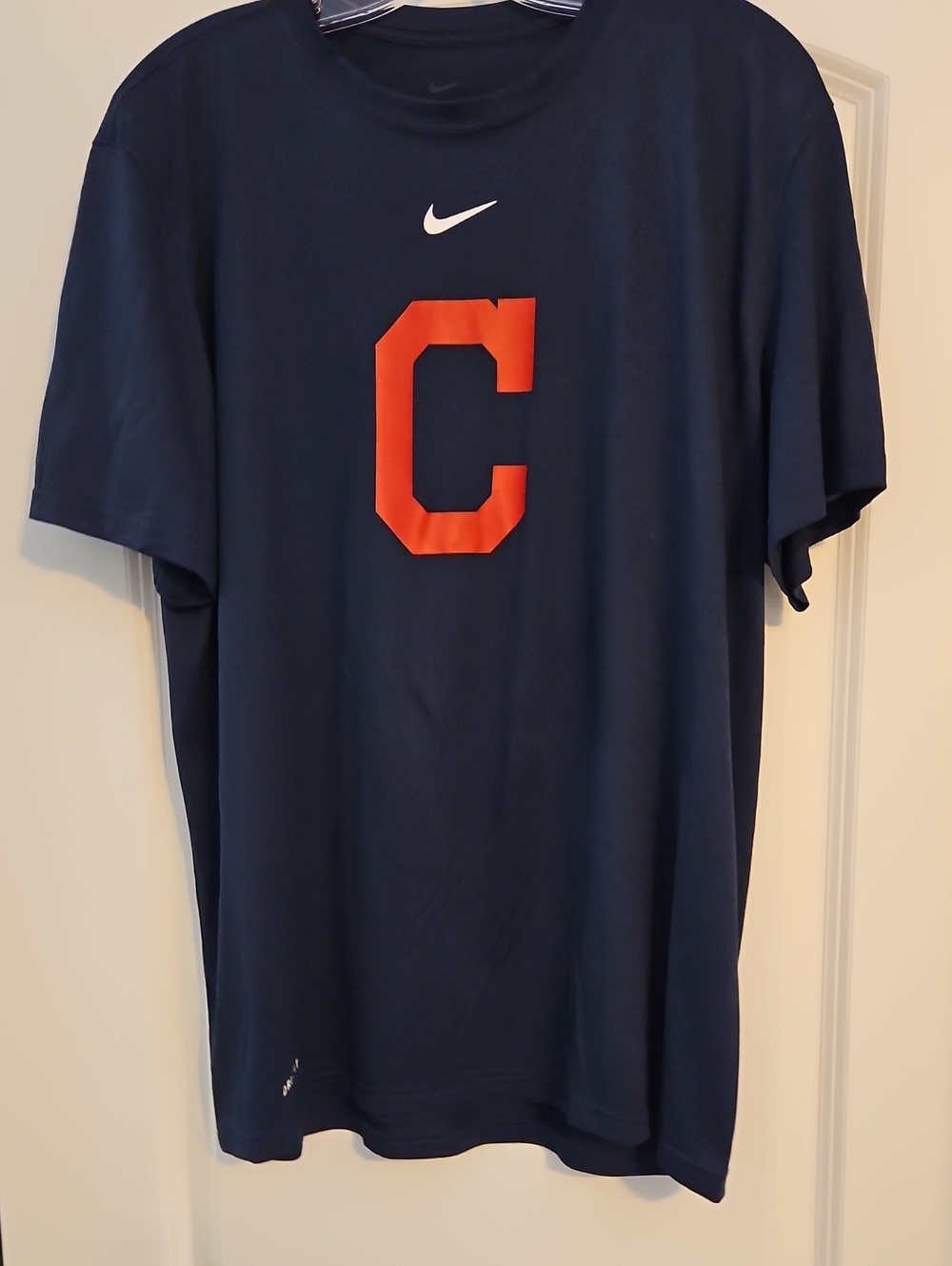 Nike Men's Navy Blue T-Shirt with Orange 'C' Graphic